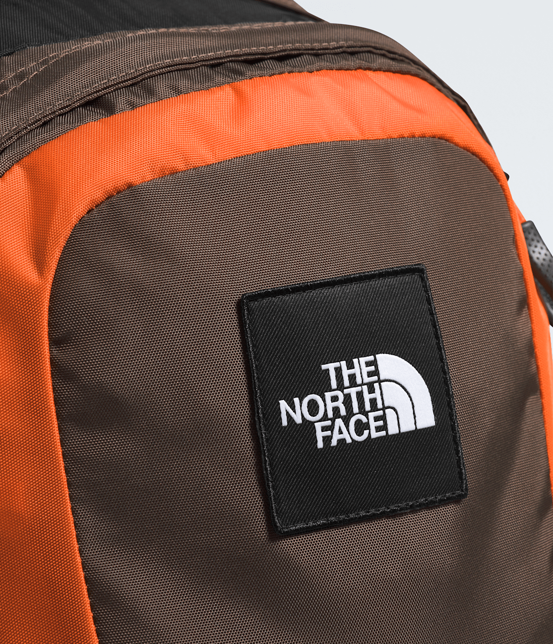 Hot Shot SE Backpack Smokey Brown/TNF Black/Solar Flare